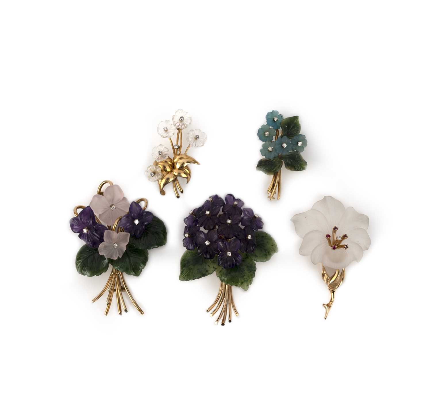 A collection of five carved stone and diamond brooches, mid 20th century, comprising: two designed