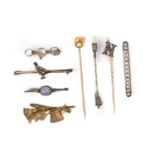 A collection of stick pins and brooches, 19th and early 20th century, comprising: two gold stick