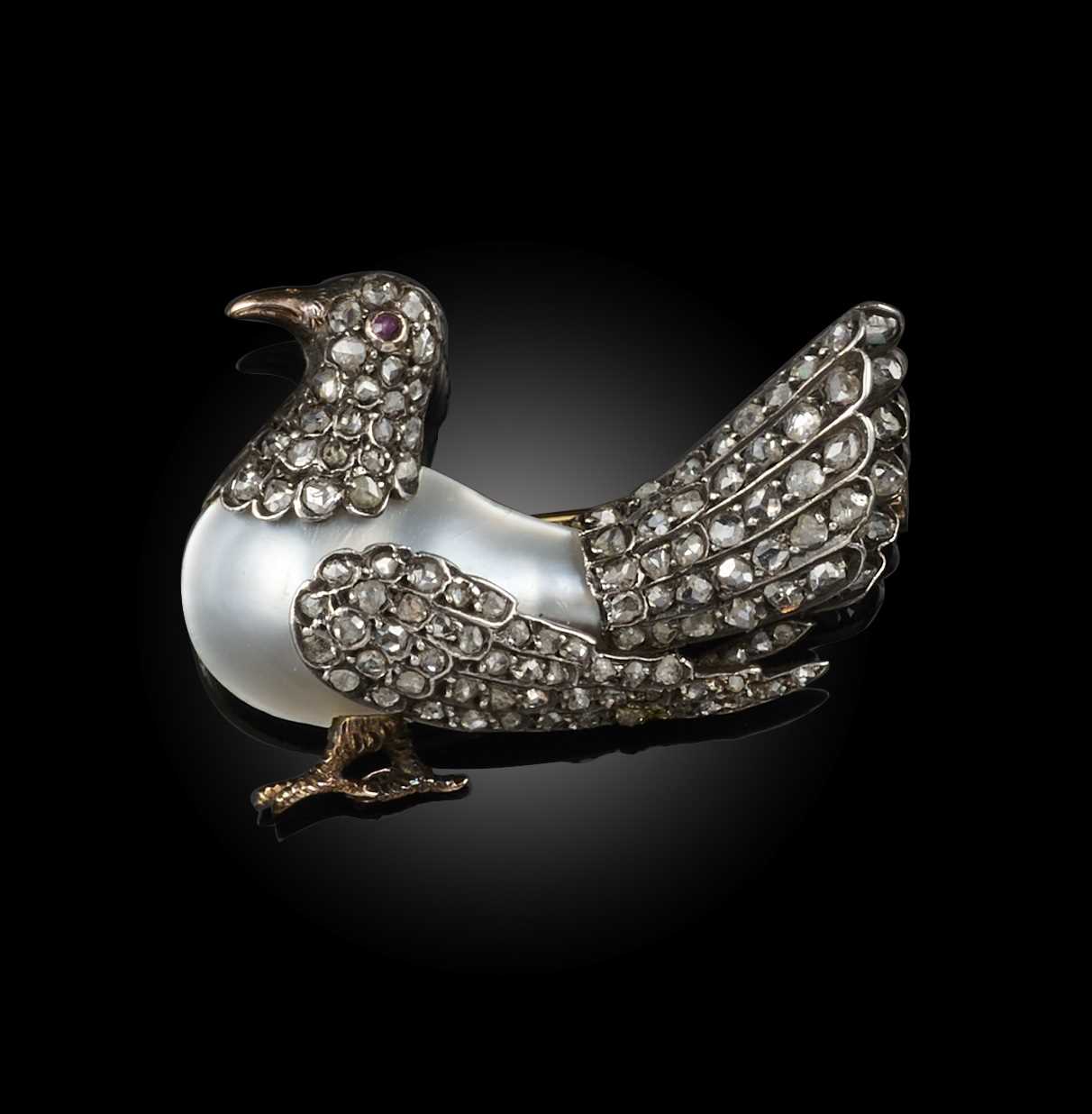 A mabé pearl and diamond brooch, late 19th century, designed as a stylised dove, its body formed