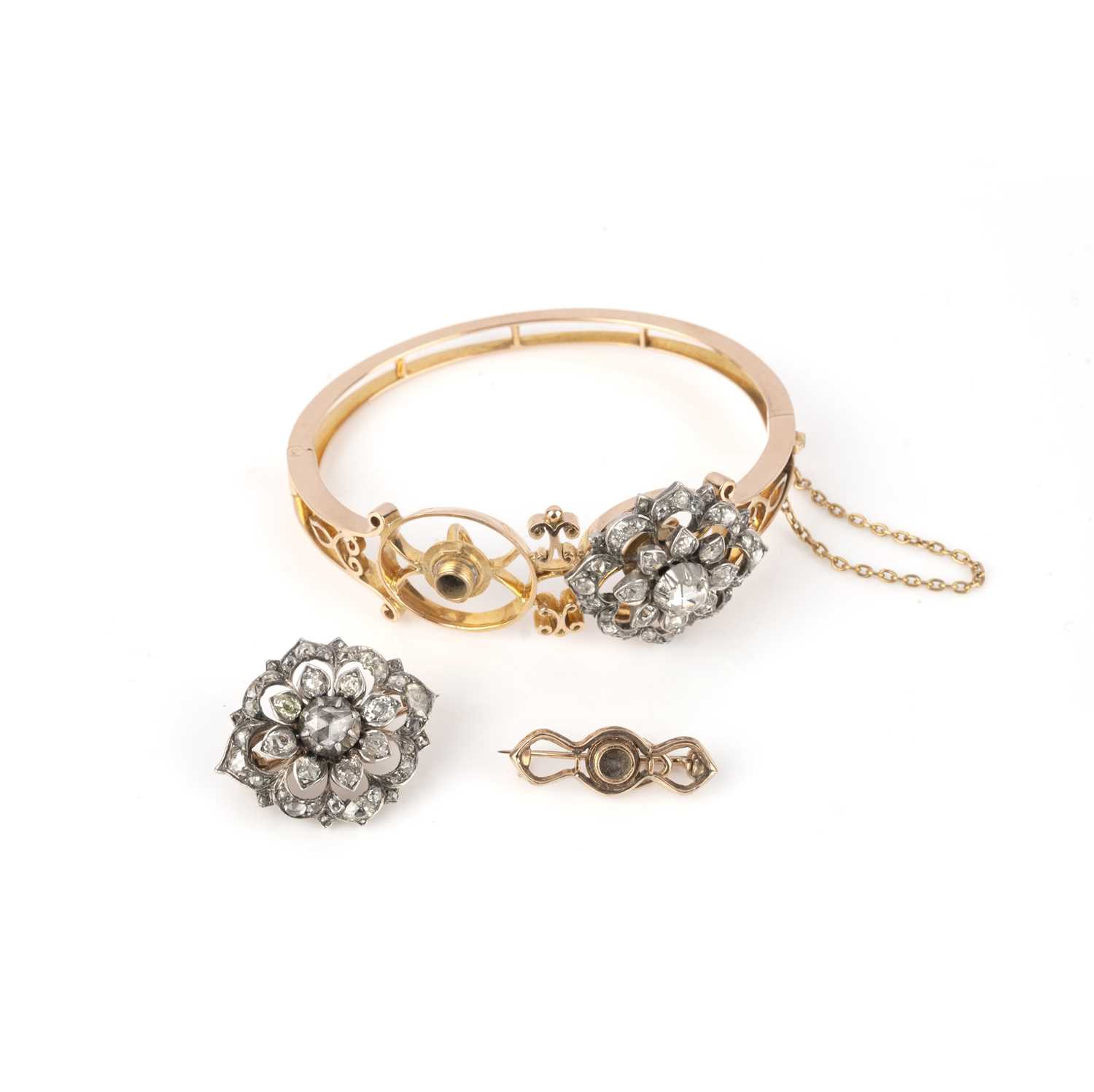 An unusual convertible diamond bangle/pair of brooches, late 19th century, the hinged gold bangle of - Image 3 of 3