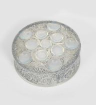 'Roger' a Lalique opalescent glass box and cover designed by Rene Lalique, circular form, cast R