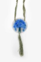 'Bouquet de Fleurs' an Argy Rousseau pate de verre glass pendant, circular, cast in low relief