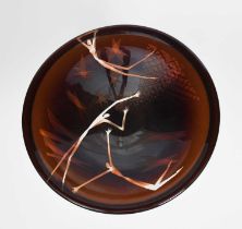 Morag Gordon (born 1959) a cast glass bowl, clear glass cased in brown with design of stylised