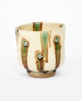 Takeshi Yasuda (born 1943) a sprigged stoneware unomi, three colour glaze, impressed seal mark,
