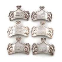 By Leslie Durbin, a matched set of six modern Queen's Coronation silver wine labels, London 1953,