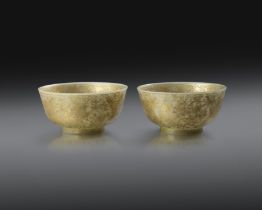 A PAIR OF CHINESE IMPERIAL GILT-DECORATED BOWENITE BOWLS FOUR-CHARACTER QIANLONG MARKS AND OF THE