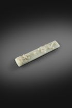 A CHINESE PALE CELADON JADE 'DRAGON' SCROLL WEIGHT 18TH CENTURY The long rectangular slab worked
