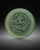 A RARE CHINESE IMPERIAL SPINACH-GREEN JADE CIRCULAR 'DRAGON' BOX AND COVER 18TH CENTURY The domed