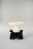 A CHINESE BLANC DE CHINE ‘RHINOCEROS HORN’ LIBATION CUP KANGXI 1662-1722 The exterior moulded in