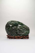 A MASSIVE CHINESE SPINACH-GREEN JADE BOULDER CARVING QIANLONG 1736-95 Well carved to one side with
