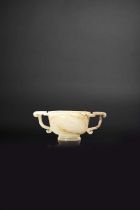 A CHINESE CELADON JADE TWO-HANDLED CUP MING/EARLY QING DYNASTY The U-shaped body carved with five