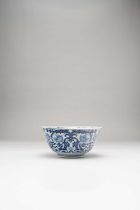 A CHINESE BLUE AND WHITE BOWL QING DYNASTY Painted with archaistic dragons and stylised blooms on