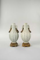 A SMALL PAIR OF CHINESE GE-TYPE VASES QING DYNASTY With slender ribbed ovoid bodies, fitted with