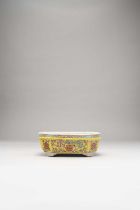 A CHINESE YELLOW-GROUND RECTANGULAR JARDINIERE 18TH/19TH CENTURY With canted corners, the exterior