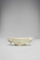A LARGE CHINESE PALE CELADON JADE TWO-HANDLED BOWL QING DYNASTY OR LATER The interior carved in
