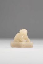 A CHINESE PALE CELADON JADE SEAL QING DYNASTY Carved with a crouching luduan, the rectangular seal
