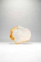 A CHINESE WHITE AND RUSSET JADEITE PEACH-SHAPED ARTIST'S PALETTE, BITIAN QING DYNASTY Carved as an
