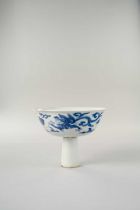 A CHINESE BLUE AND WHITE ‘DRAGON’ STEM BOWL KANGXI 1662-1722 The shallow bowl with a flared rim,