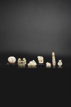 SEVEN SMALL CHINESE CELADON JADE CARVINGS 18TH AND 19TH CENTURY One of a seated crane holding a