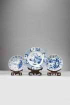 THREE CHINESE BLUE AND WHITE DISHES KANGXI 1662-1722 Comprising: a dish painted with landscape