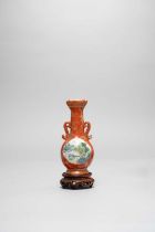 A CHINESE FAMILLE ROSE CORAL GROUND AND GILT DECORATED MINIATURE TWO-HANDLED BOTTLE VASE 18TH