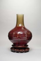 A CHINESE FLAMBE GLAZED 'TRIGRAMS' BOTTLE VASE 18TH CENTURY The bulbous body moulded in relief