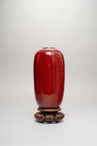 A CHINESE FLAMBE 'WINTER MELON' VASE 18TH/19TH CENTURY Covered with a deep red glaze, thinning to