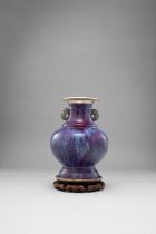 A CHINESE FLAMBE-GLAZED TWIN HANDLED BALUSTER VASE 18TH CENTURY Decorated in a vibrant purple and