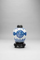 A CHINESE BLUE AND WHITE OVOID JAR KANGXI 1662-1722 Painted with linked cartouches of scrolling