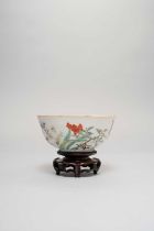 A CHINESE ENAMELLED 'FLOWERS' BOWL DAOGUANG 1821-50 The rounded bowl painted to the exterior with