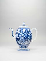 A JAPANESE BLUE AND WHITE TEAPOT AND COVER MEIJI ERA, 19TH/20TH CENTURY The tall bulbous body raised