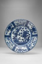 A LARGE JAPANESE BLUE AND WHITE KRAAK-STYLE DISH EDO PERIOD, C.1700 The well painted with large