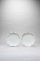 A PAIR OF JAPANESE MOULDED PEONY DISHES EDO OR MEIJI, 19TH CENTURY Both with light celadon bodies