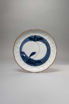 A JAPANESE BLUE AND WHITE MOULDED DISH EDO PERIOD, 17TH CENTURY The foliate body painted with a