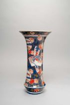 A TALL JAPANESE IMARI TRUMPET-SHAPED VASE EDO PERIOD, C.1700 The slender body typically decorated in