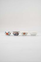 FOUR JAPANESE TEA BOWLS EDO PERIOD, 17TH CENTURY The first embellished with flowerheads linked by