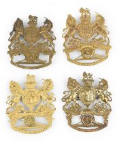 Royal Artillery: four home service helmet plates, the first a Victorian officer's gilt example;