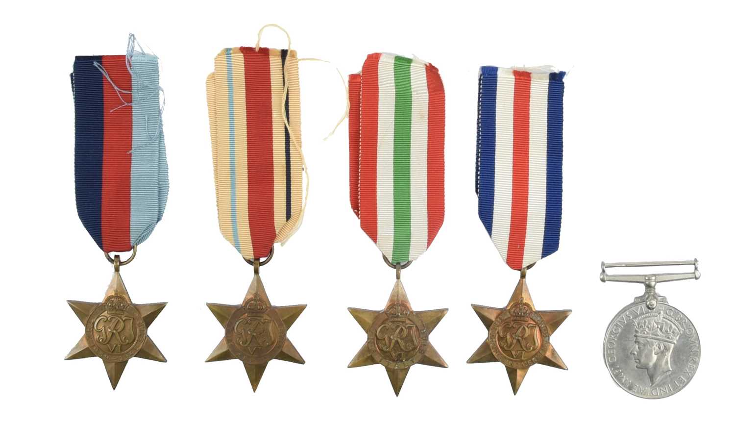 A collection of Second World War medals and insignia, comprising: 1939-45 Star, Africa Star, Italy