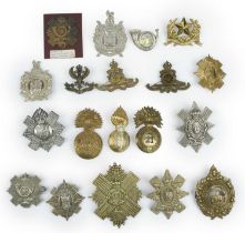 A quantity of Victorian and later headress badges, mainly Scottish regiments, including glengarry