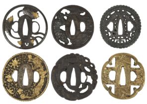 Six Japanese sword guards (tsuba), the first maru-gata, with an openwork design involving maple