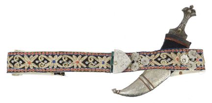 A Yemeni dagger (jambiya), broad curve blade 6.25 in. with medial ridge, embossed and studded silver