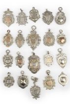 A collection of silver fobs, late 19th and early 20th century, some with prize inscriptions. [20]