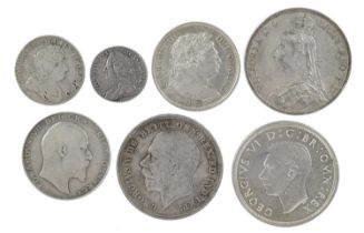 A small collection of British silver coins, comprising: George I, shilling, 1723, South Sea