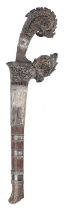 λ A Sumatran dagger, single edged slightly re-curving blade 7.5 in., carved horn hilt of stylised