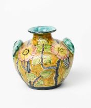 A Della Robbia Pottery vase by Charles Collis, ovoid with modelled handles, incised and painted with