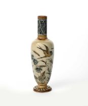A Martin Brothers stoneware vase by Robert Wallace Martin, dated 1884, slender bottle form with
