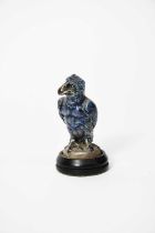 A Martin Brothers stoneware miniature bird by Robert Wallace Martin, modelled with claw feet,