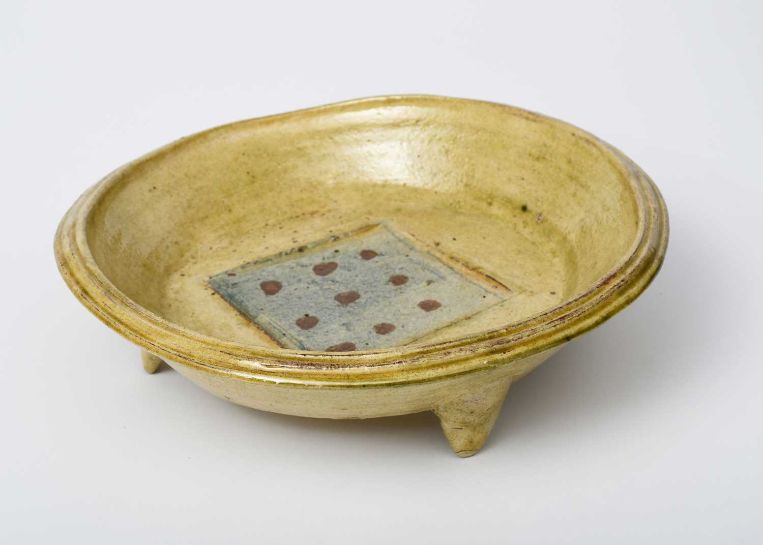 Geoff Fuller (1936-2022) a stoneware bowl on three feet, painted to the well with geometric panel, a