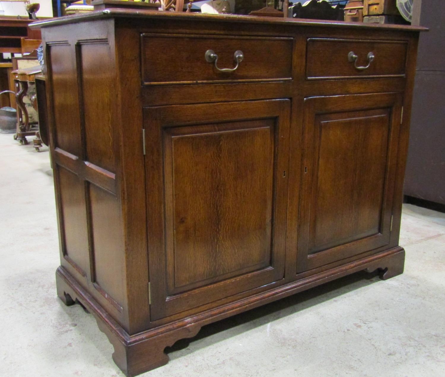 A good quality reproduction Georgian style oak side cupboard partially enclosed by a pair of - Image 2 of 3