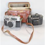 A Minolta Rokkor Automatic camera and a further Certo Dollina vintage camera in leather case